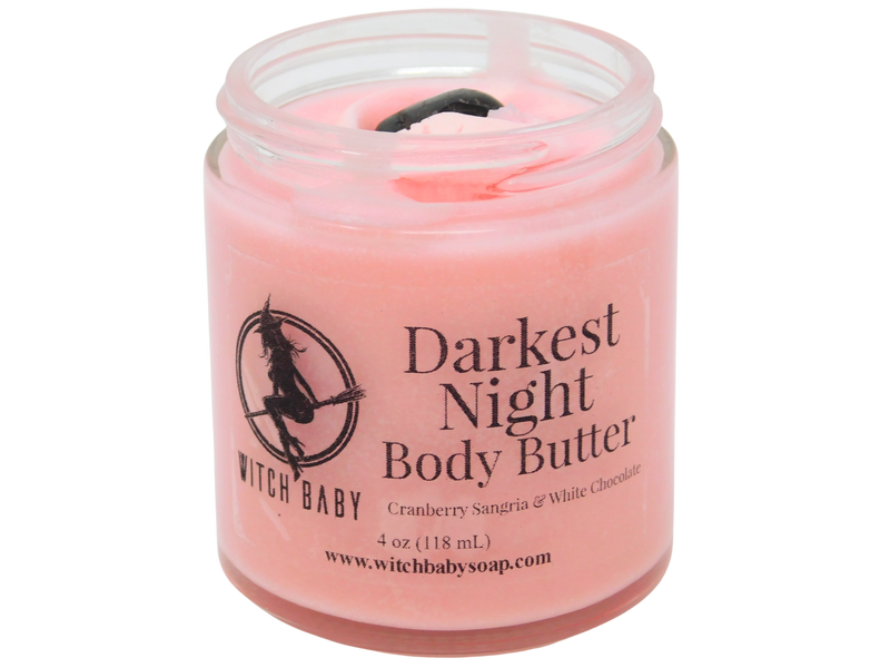 4 oz glass jar filled with pink body butter and topped with tumbled garnet. clear label reads: darkest night body butter. cranberry sangria & white chocolate.